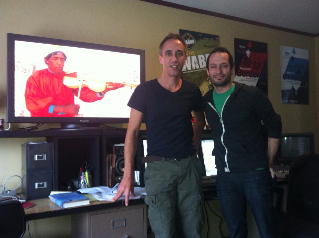 Director Sterling Noren and musician Trace Bundy, with Ignacio 'Nacho' Palma on the screen in the background.
